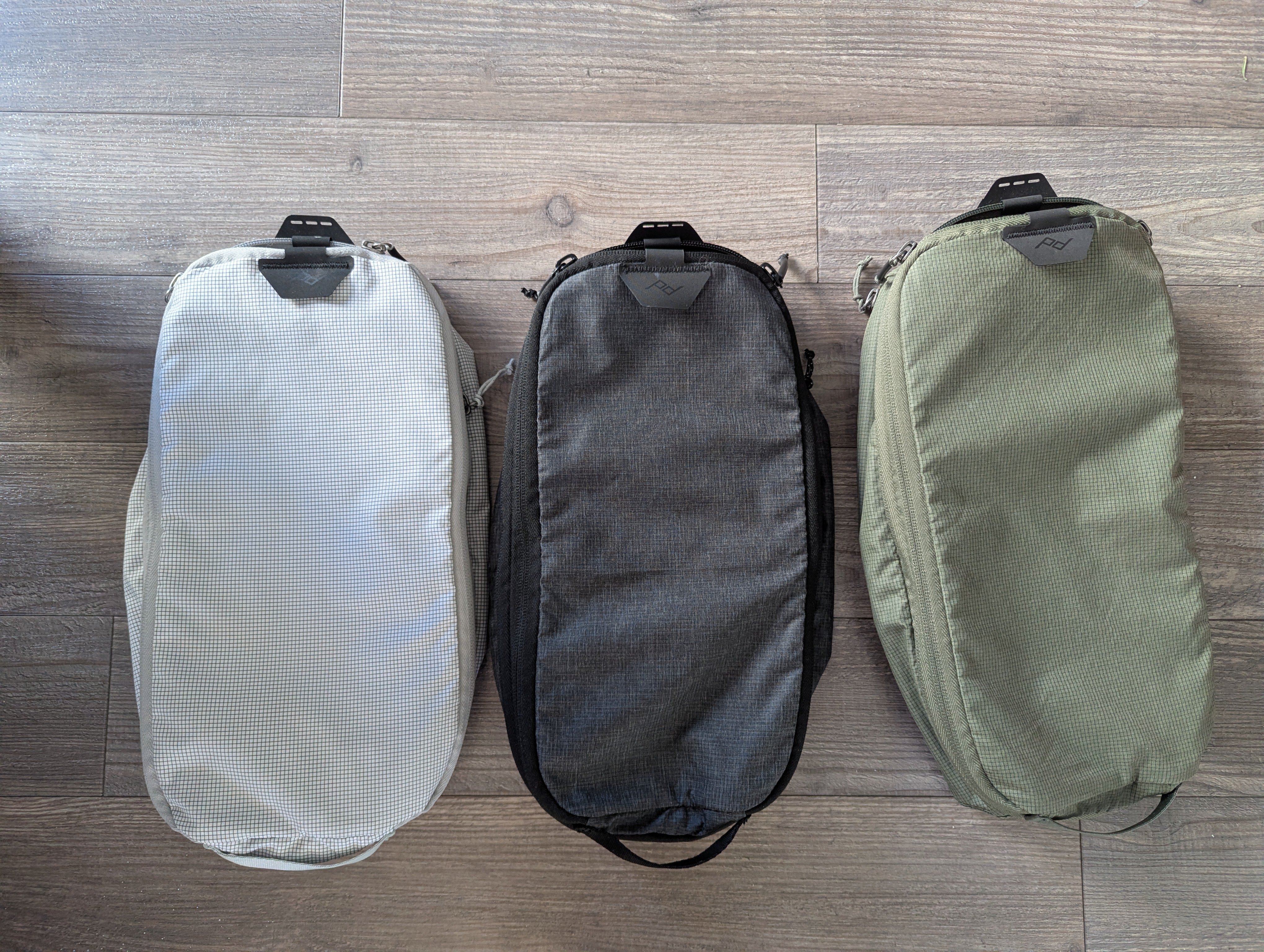 A picture of three Peak Design small packing cubes.