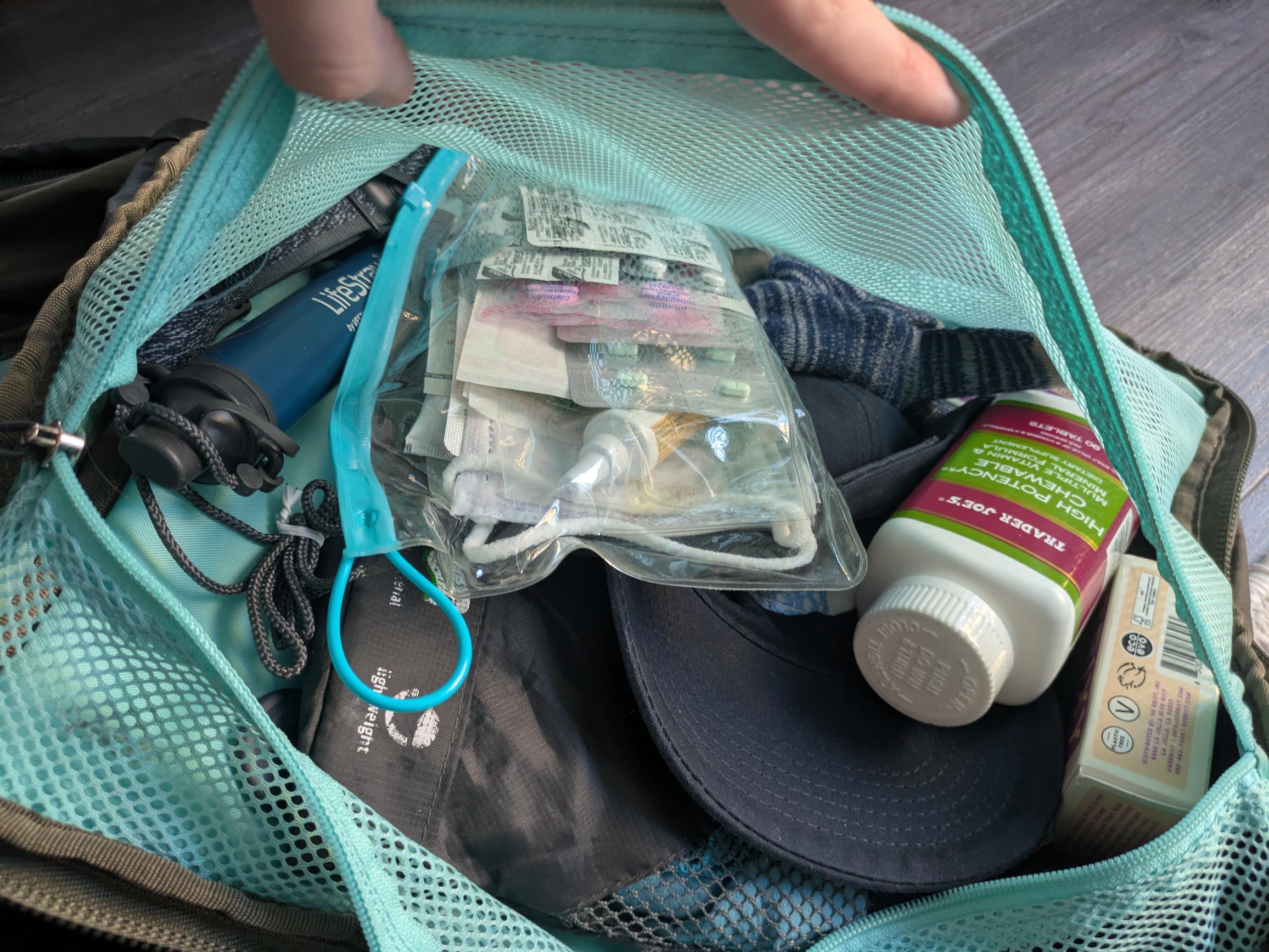 Messy pouch full of medicine.