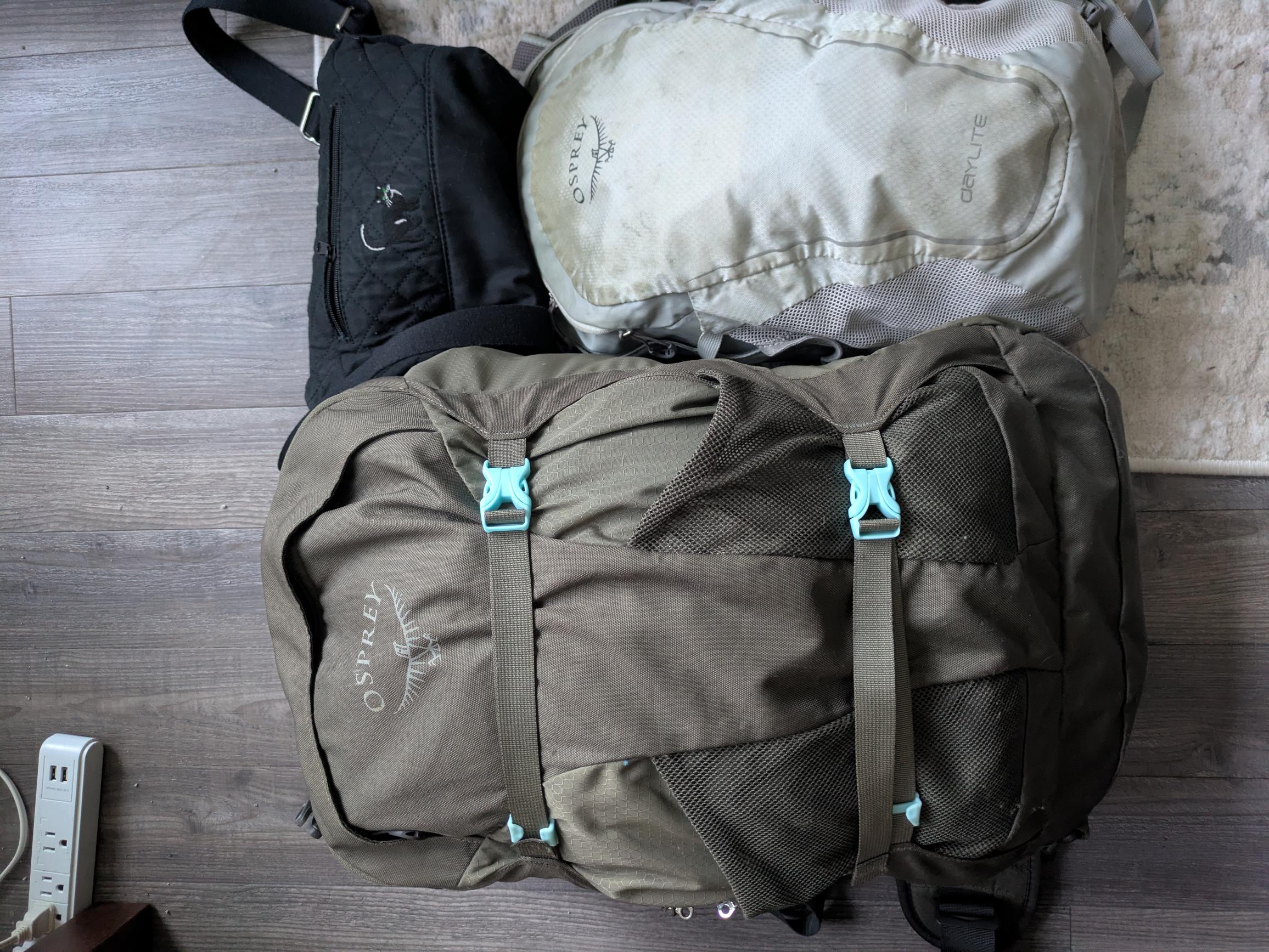 The packed Osprey big backpack and daypack